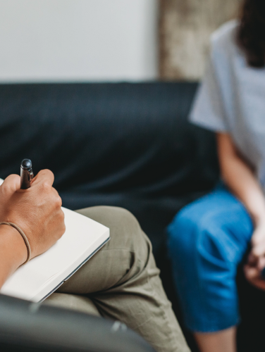 Counselling session, woman talking to counsellor in the studio