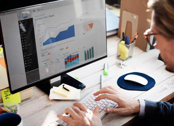 Header - CJS Initiatives Photo of a man using a web data dashboard